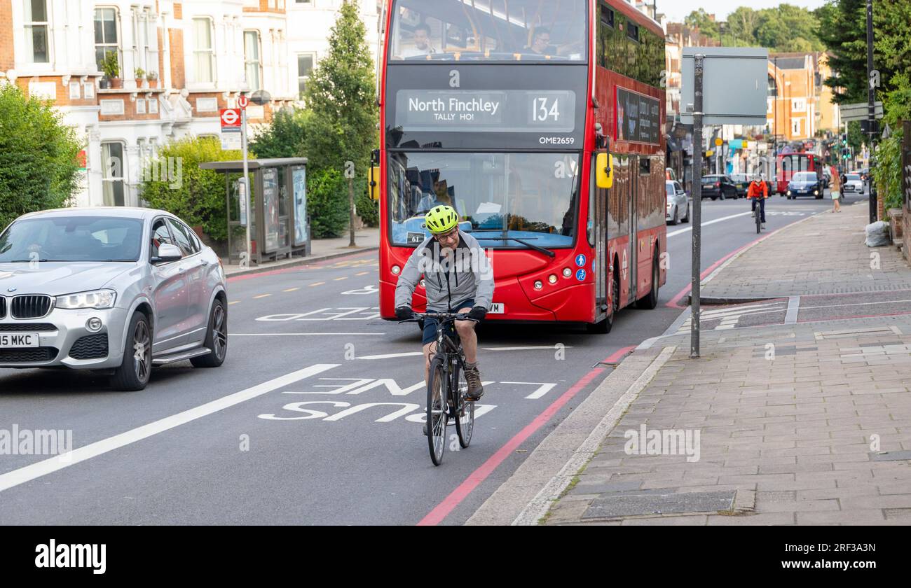 Cycling in bus lane hi res stock photography and images Alamy