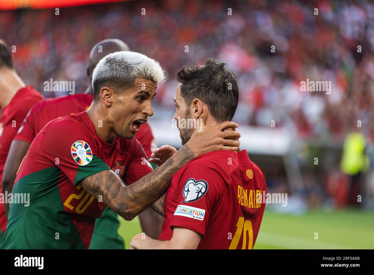 Bernardo Silva and Joao Cancelo celebrate after scored goal during UEFA Euro 2024 Qualification game between national teams of Portugal and Bosnia and Stock Photo
