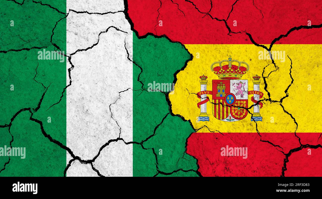 Flags of Nigeria and Spain on cracked surface politics, relationship