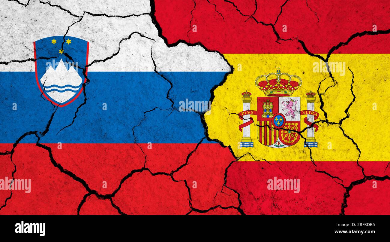 Flags of Slovenia and Spain on cracked surface - politics, relationship ...
