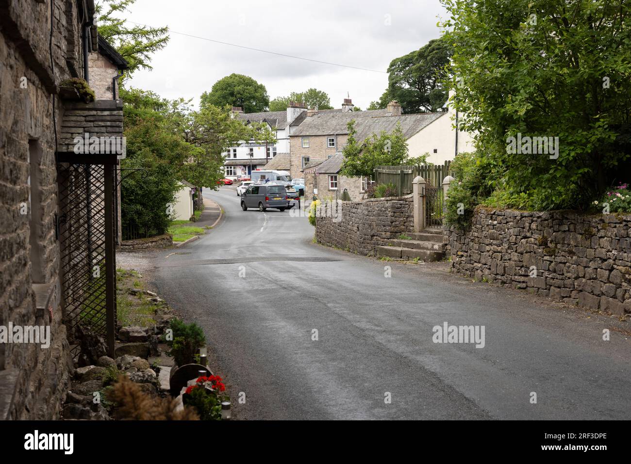 On an overcast afternoon, distant views of the George Hotel Orton in Westmorland Stock Photo