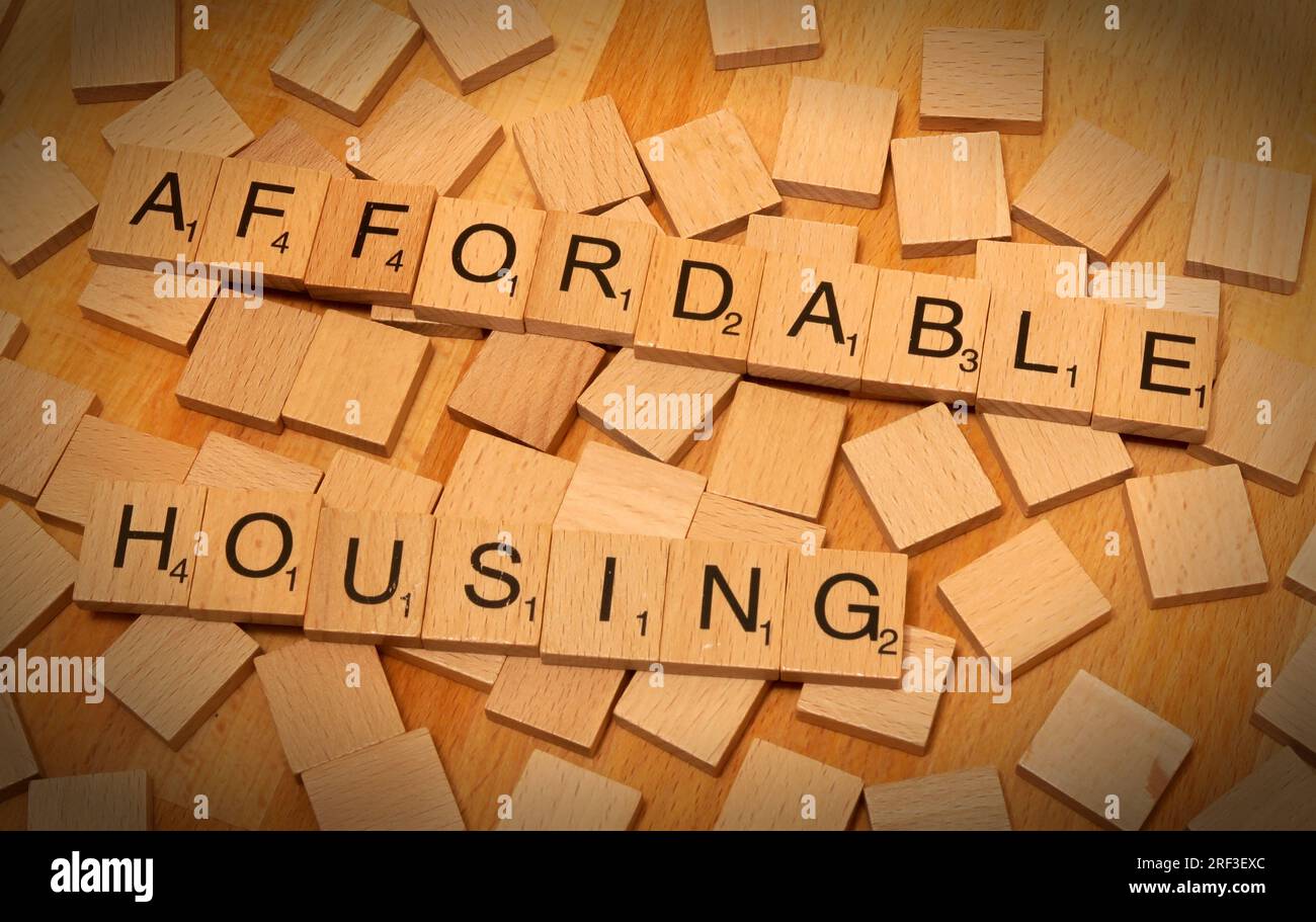 Affordable Housing, spelt out in Scrabble letters - UK SocialHousing and new build 80% of market cost provision Stock Photo