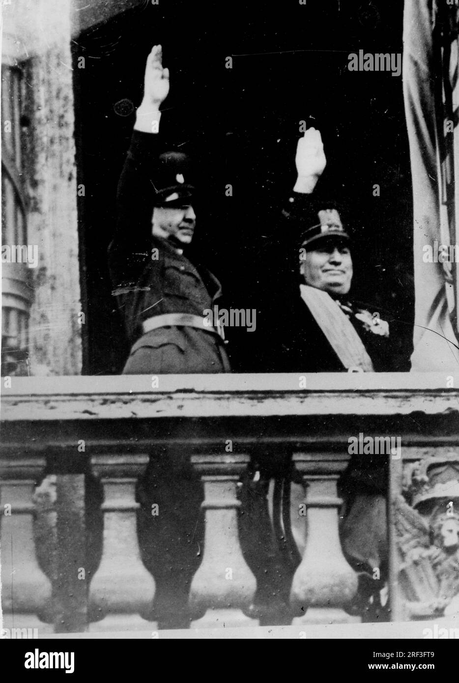 Circa Late 1930's- early 1940's - Rome, Italy - BENITO MUSSOLINI, right, the Italian dictator and leader of the Fascist movement stands with Ustase Croatian Leader ANTE PAVELIC in full uniform and salute from the balcony of the Palazzio Venezia in Rome. (Credit Image: © Keystone Press Agency/ZUMA Press Wire) EDITORIAL USAGE ONLY! Not for Commercial USAGE! Stock Photo
