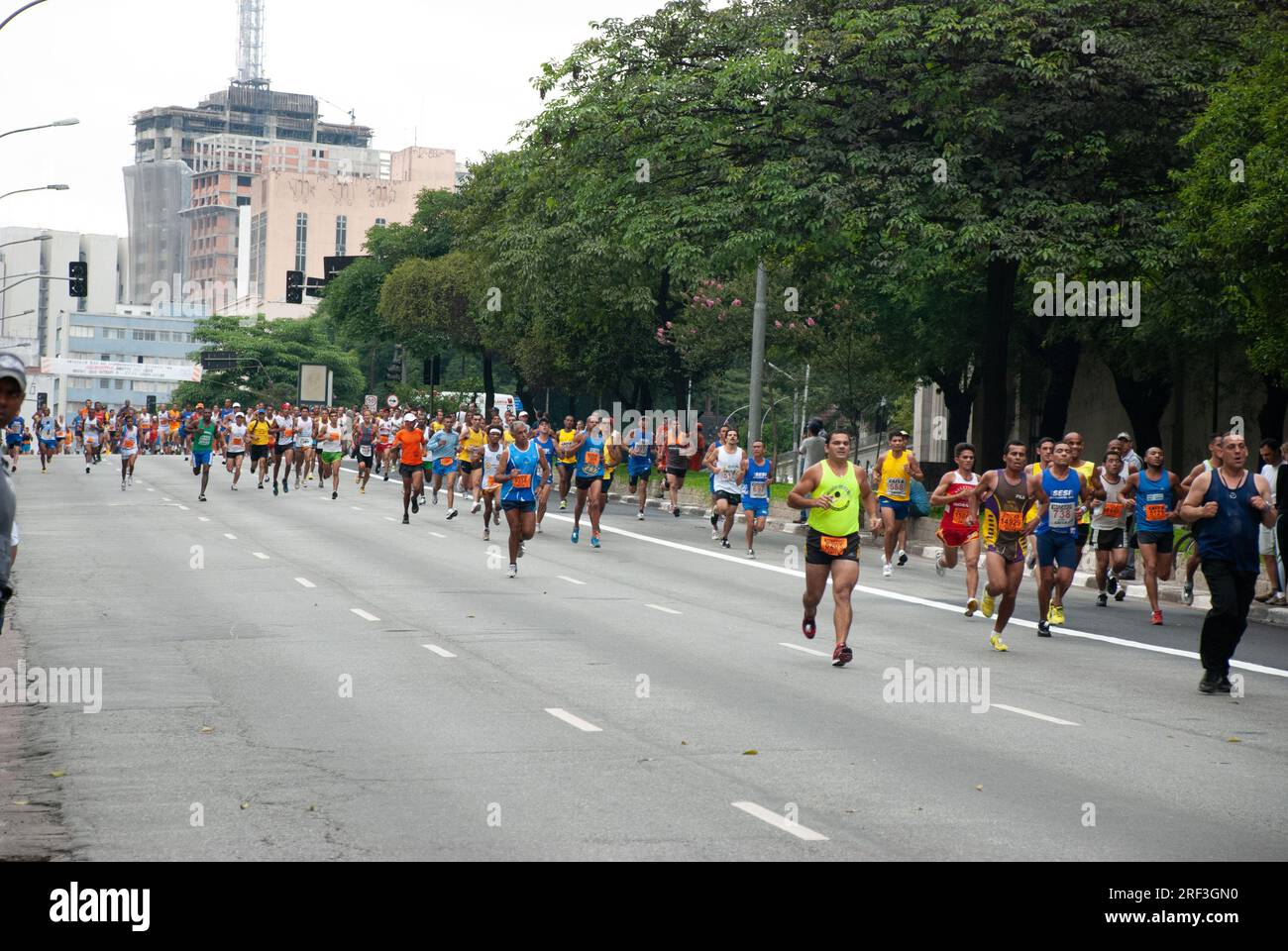 Group of people participating in the Saint Sylvester Road Race at Rua Consolação, São Paulo. Brazil Stock Photo