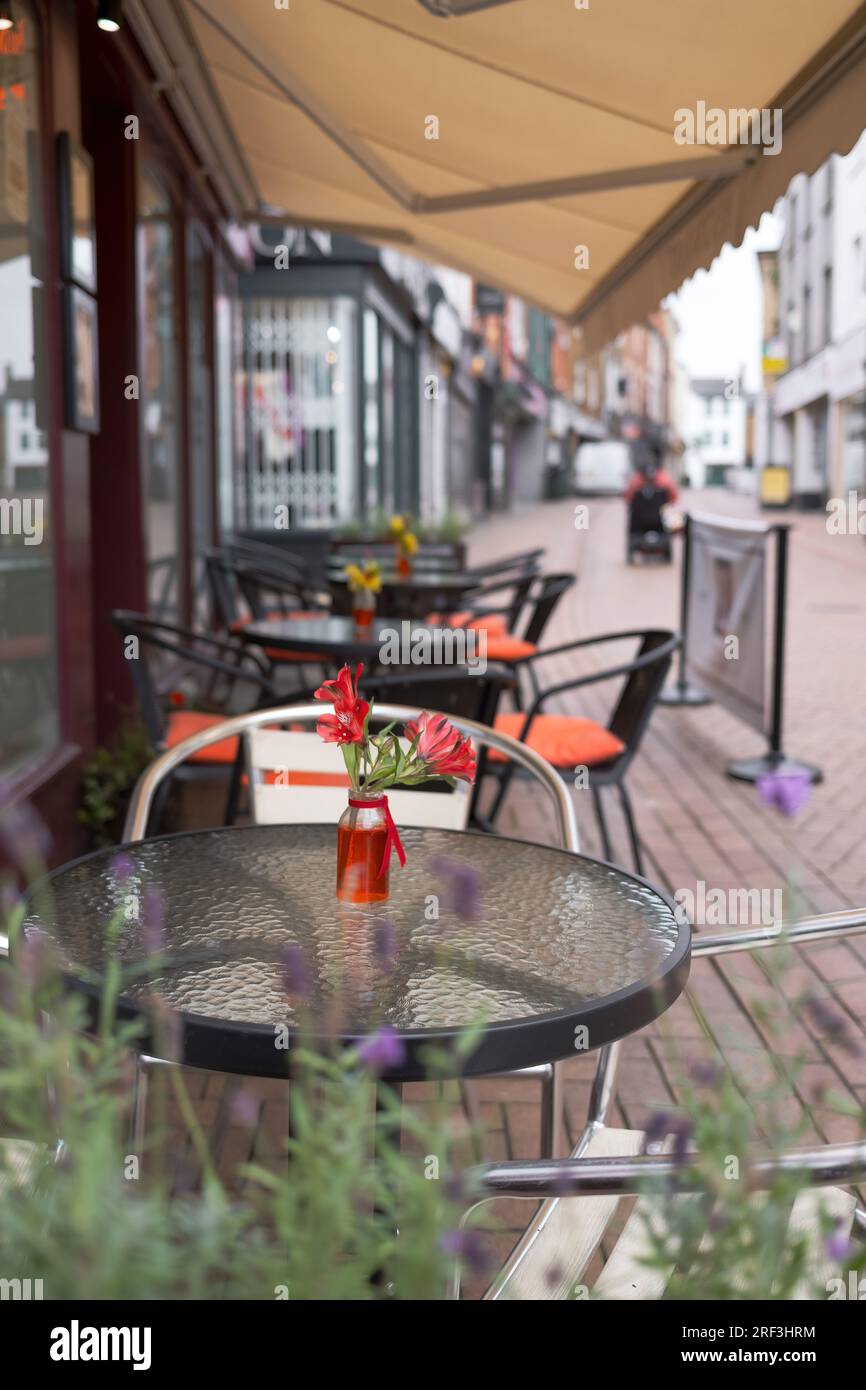 Outdoor seating at a cafe on the high street in Banbury, a market town