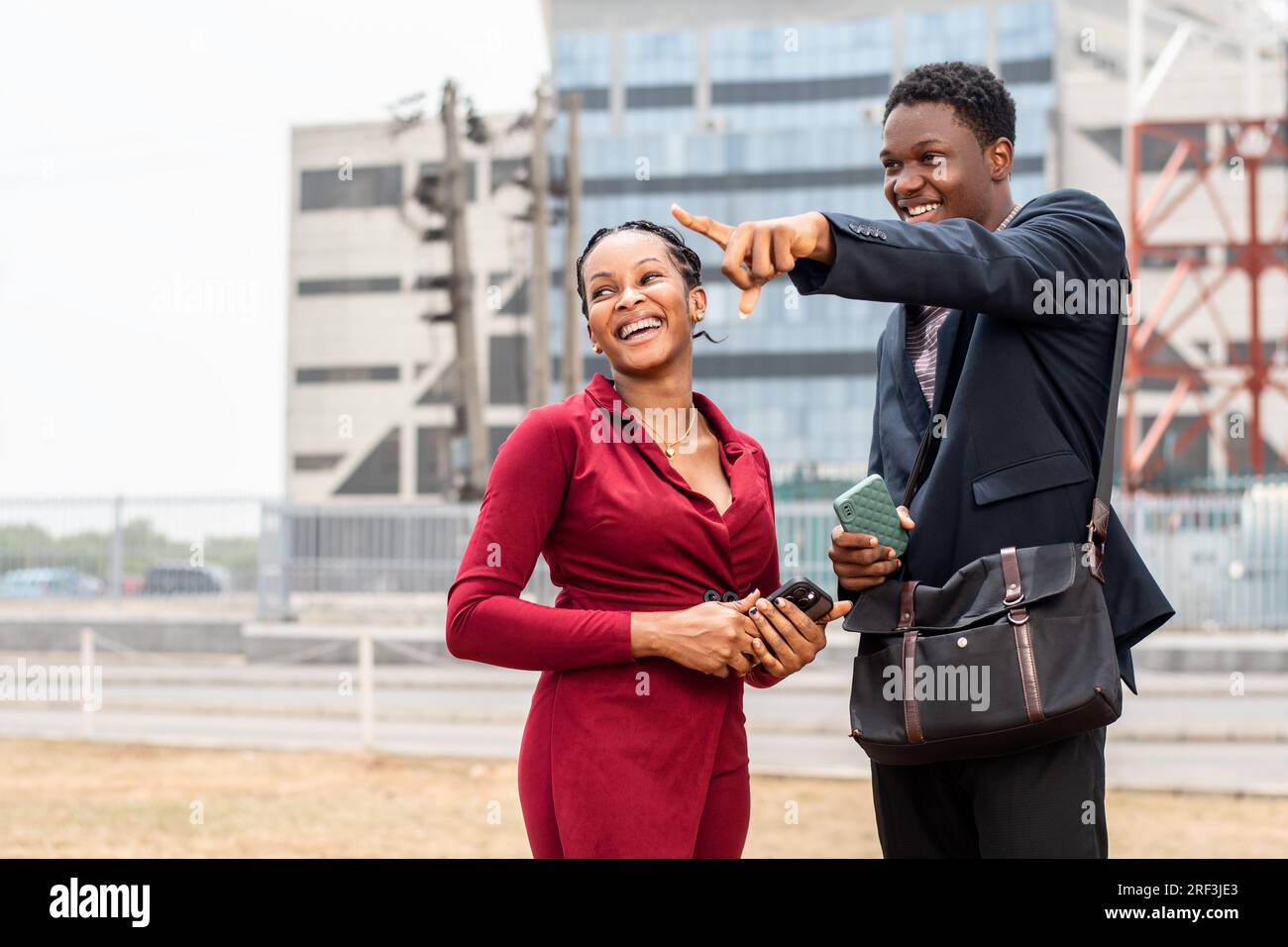 african businessman giving a lady directions Stock Photo