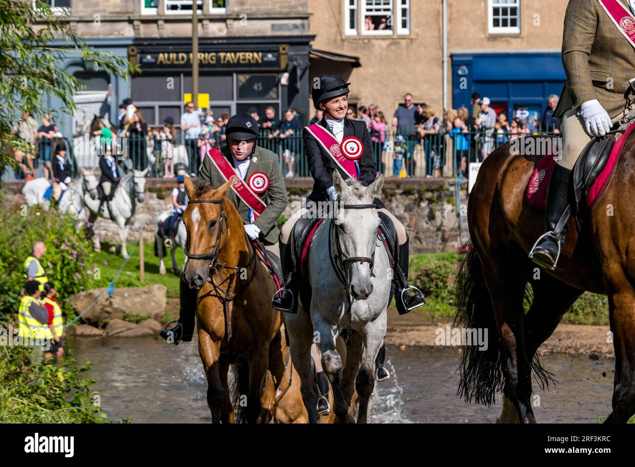 Horse riders crossing River Esk in rideout, Musselburgh Festival, East Lothian, Scotland, UK Stock Photo