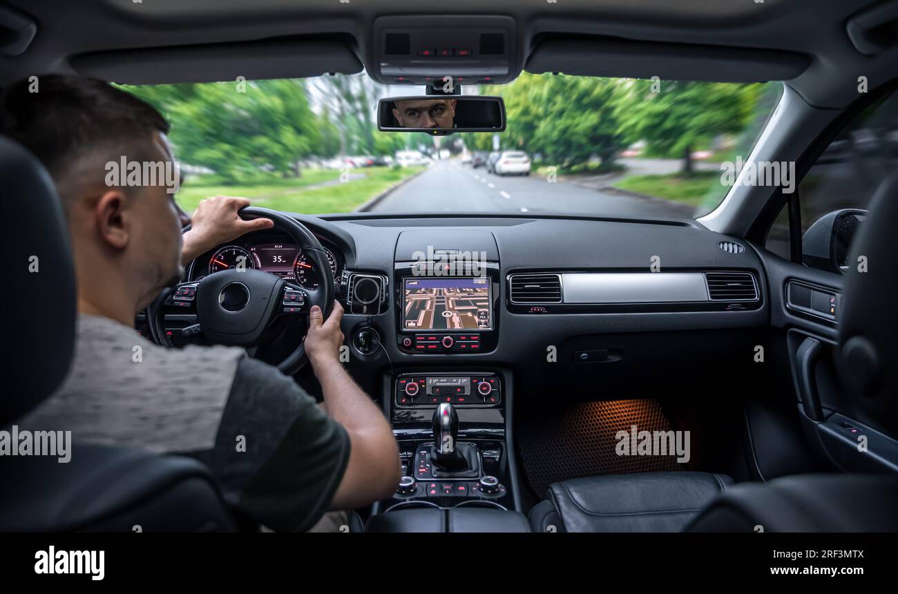 Hands on the wheel when driving at high speed from inside the car Stock