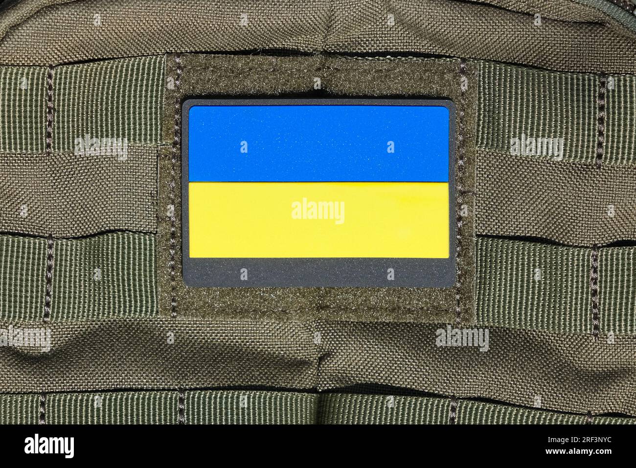 Patch on an adhesive tape with the Ukrainian flag on a military uniform