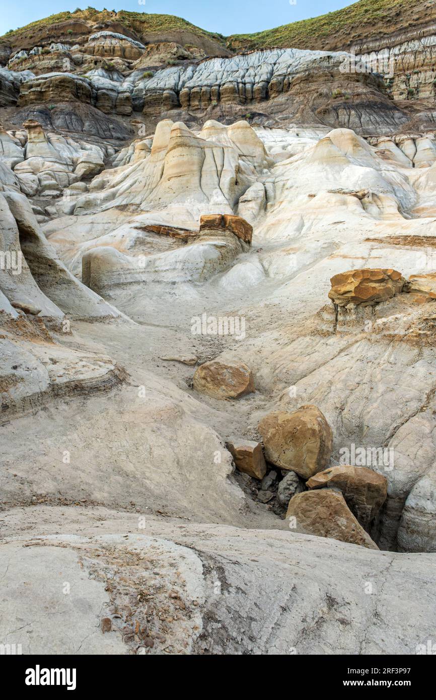 The Badlands are a popular sightseeing destination in Drumheller Alberta cosidting of sandstone formations that have been formed through erosion cause Stock Photo