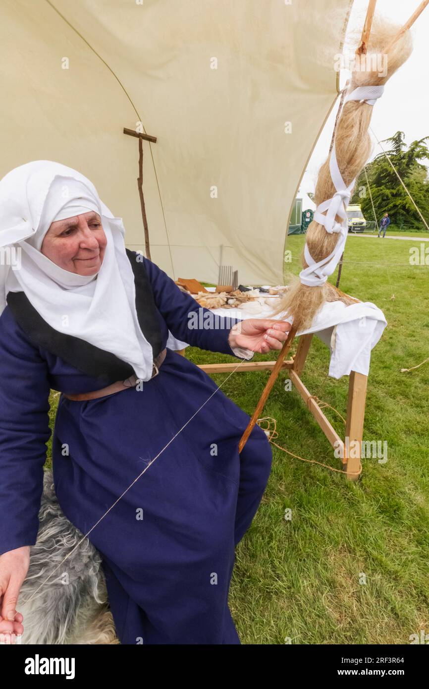 Portrait of woman in medieval costume weaving silk hi-res stock ...