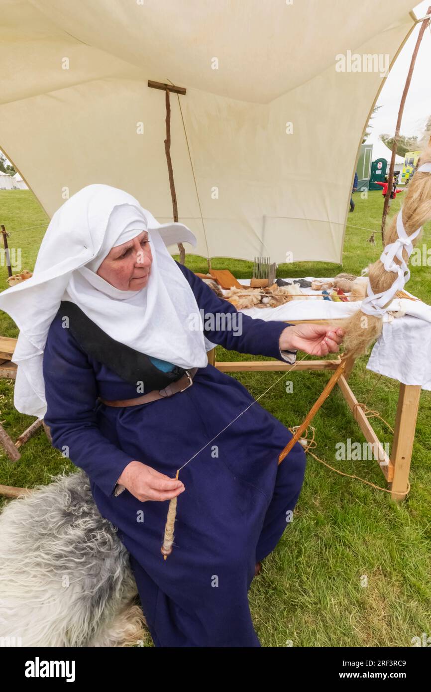 Portrait of woman in medieval costume weaving silk hi-res stock ...