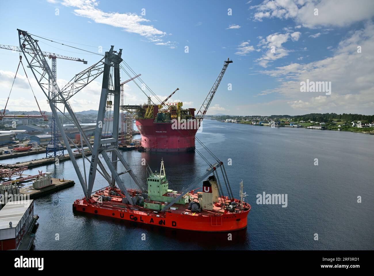 Norwegian crane ship Uglen and floating storage/production vessel