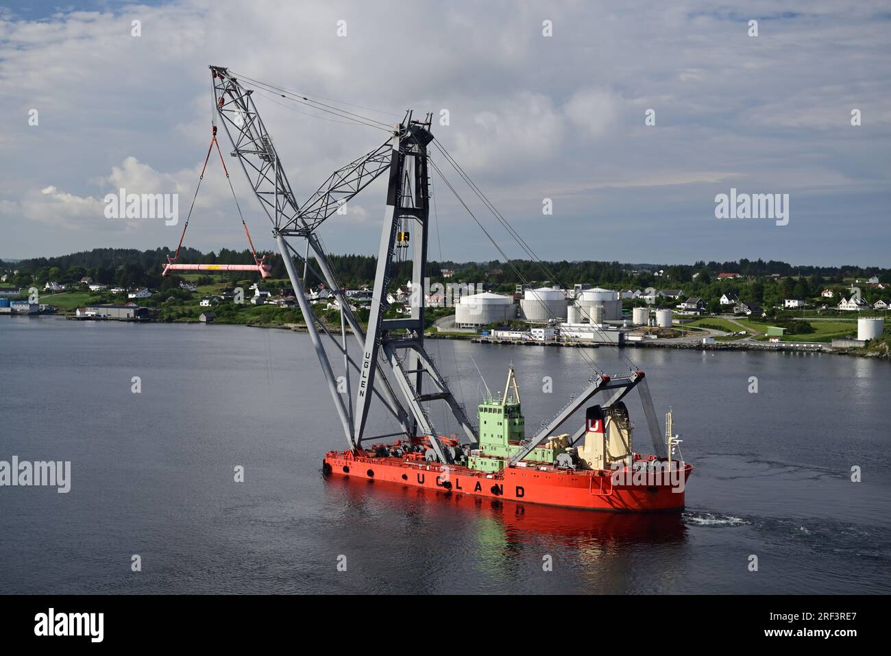 Norwegian crane ship Uglen in the Karmsund at Haugesund in Rogaland county. Stock Photo