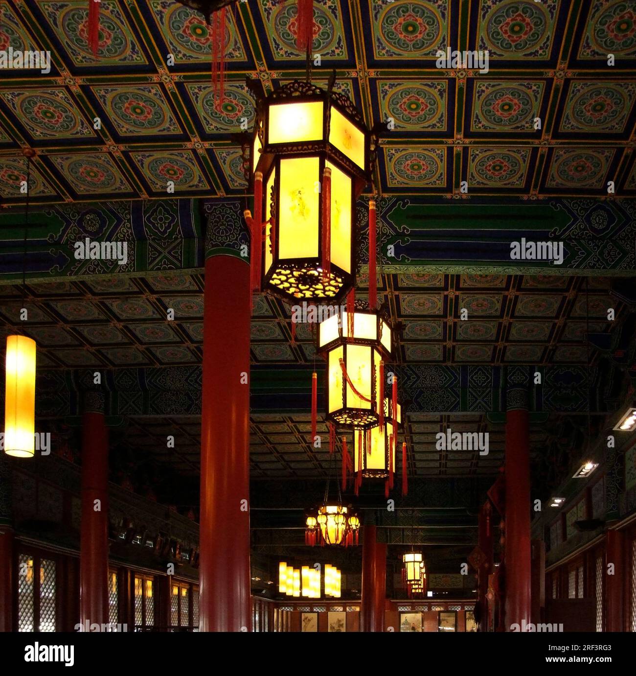 indoor scenery with decorative ornamented chinese ceiling and traditional lamps Stock Photo