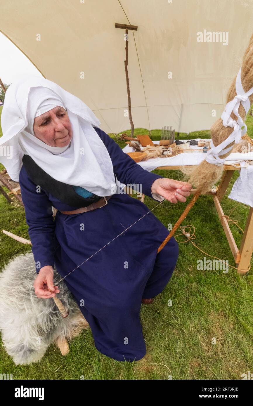 Portrait of woman in medieval costume weaving silk hi-res stock ...