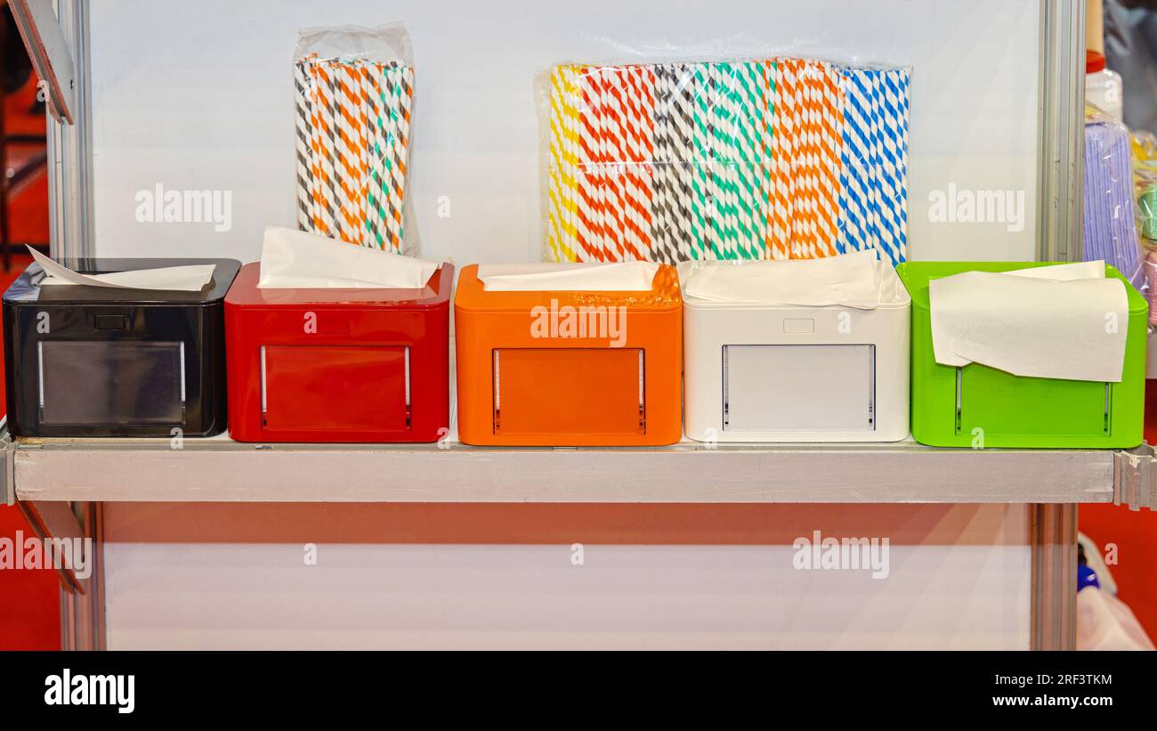 Commercial Paper Napkin Dispensers and Drinking Straws Set Stock Photo