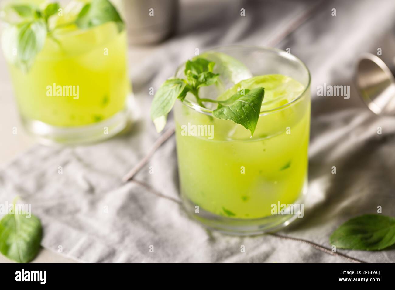 Gin Basil Smash Cocktail booze gin, lemon juice, syrup and basil leaves