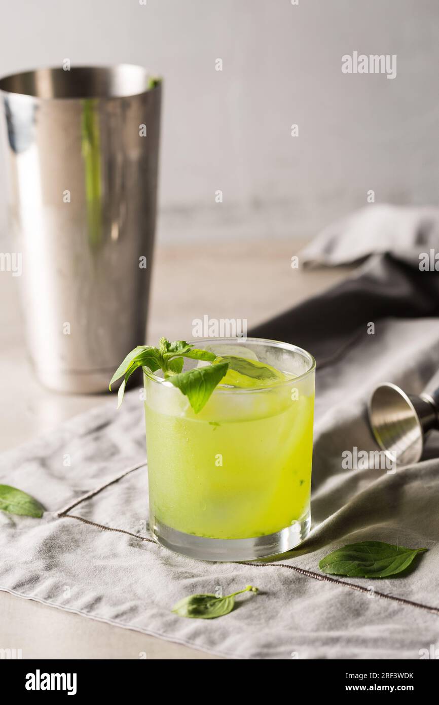 Gin Basil Smash Cocktail booze gin, lemon juice, syrup and basil leaves