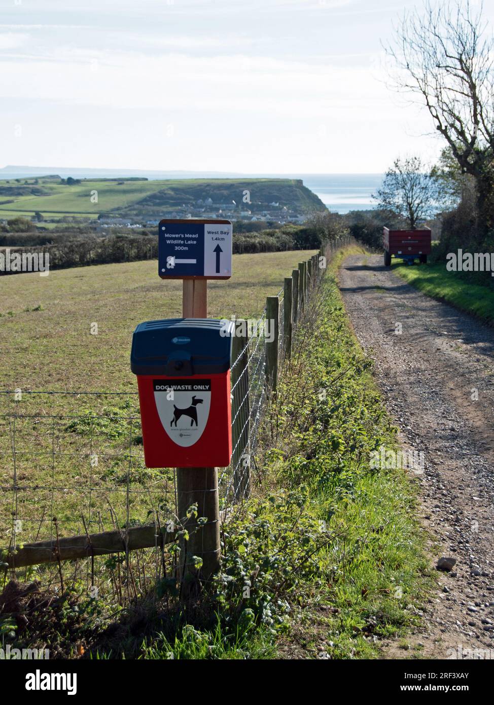 Dog waste bin on Dorset footpath Stock Photo Alamy