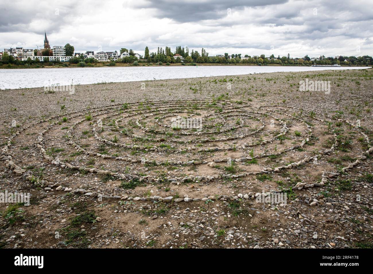 stone labyrinth on the banks of the river Rhine in Rodenkirchen-Weiss, Cologne, Germany. Steinlabyrinth am Rheinufer in Rodenkirchen-Weiss, Koeln, Deu Stock Photo