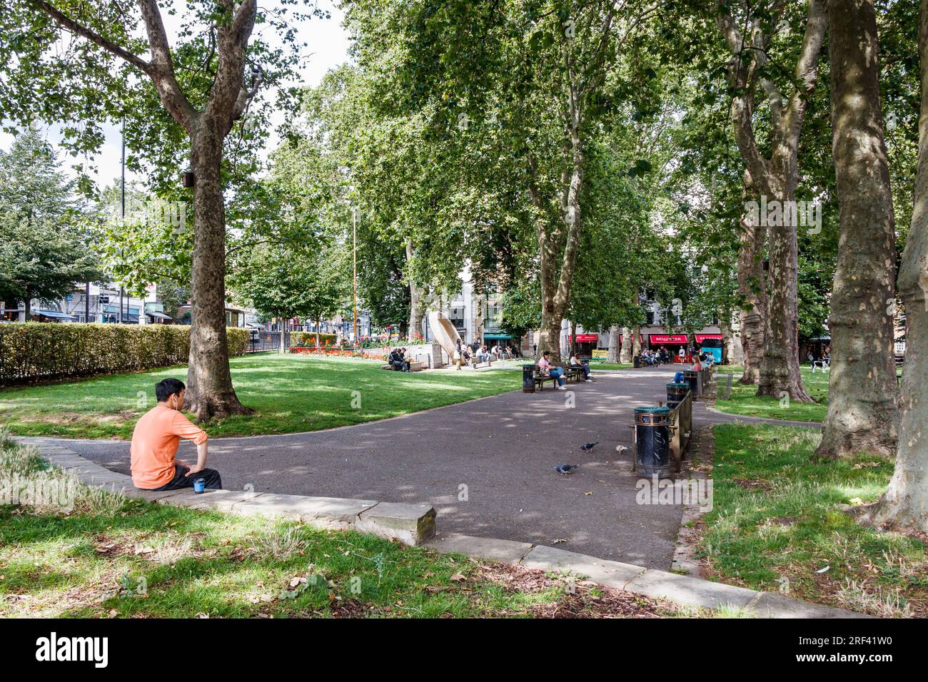 People relaxing in Islington Green, a small park at the junction of ...