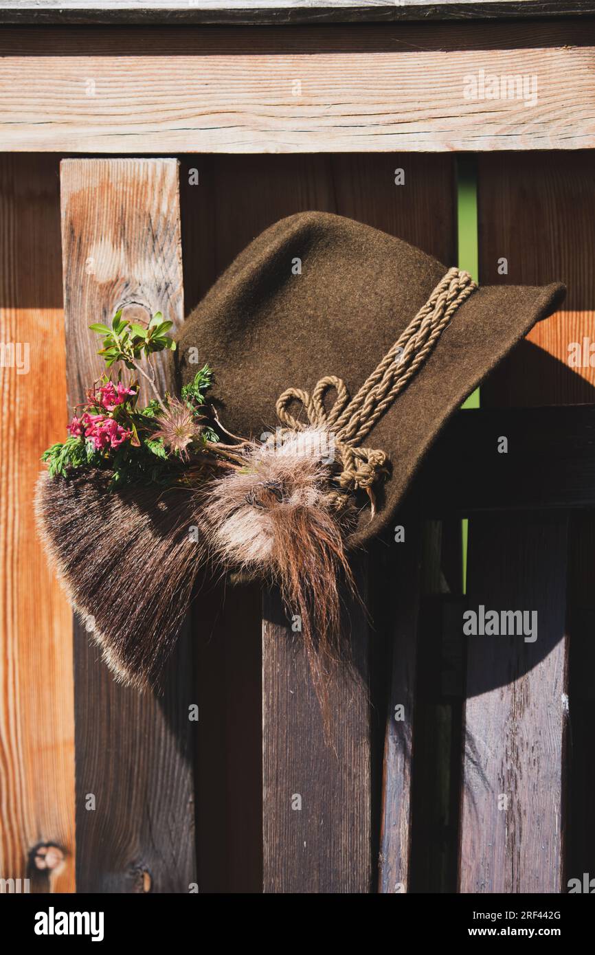 a traditional hunting hat with a chamois beard, a juniper twig and blossoms of alpine rose after the hunt Stock Photo
