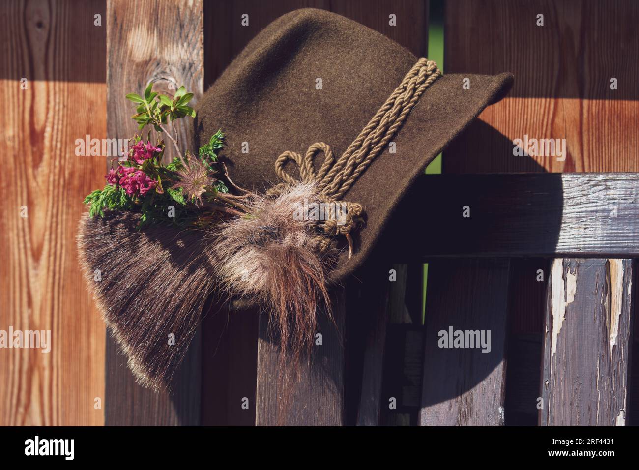 a traditional hunting hat with a chamois beard, a juniper twig and blossoms of alpine rose after the hunt Stock Photo
