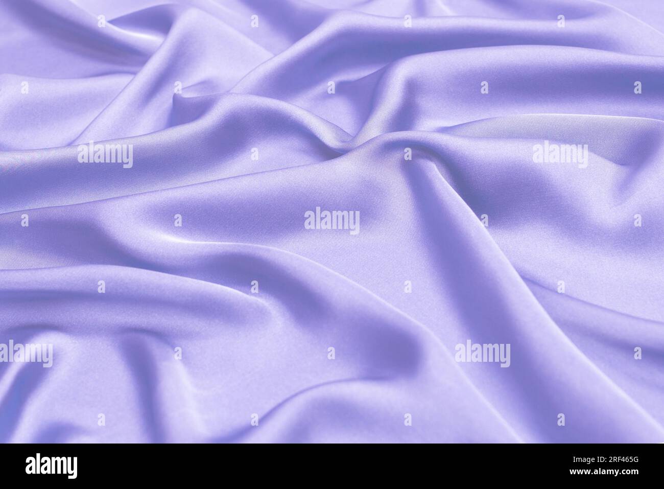 Blue silk or satin luxury fabric texture. Top view. Stock Photo
