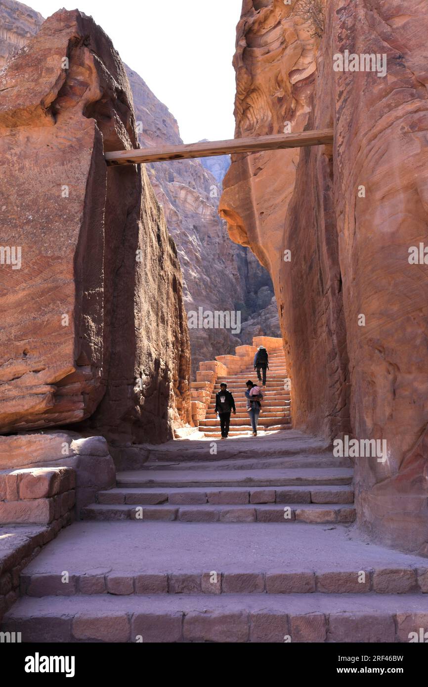 People on the Al Khubtha trail down to Petra city, UNESCO World Heritage Site, Wadi Musa, Jordan, Middle East Stock Photo