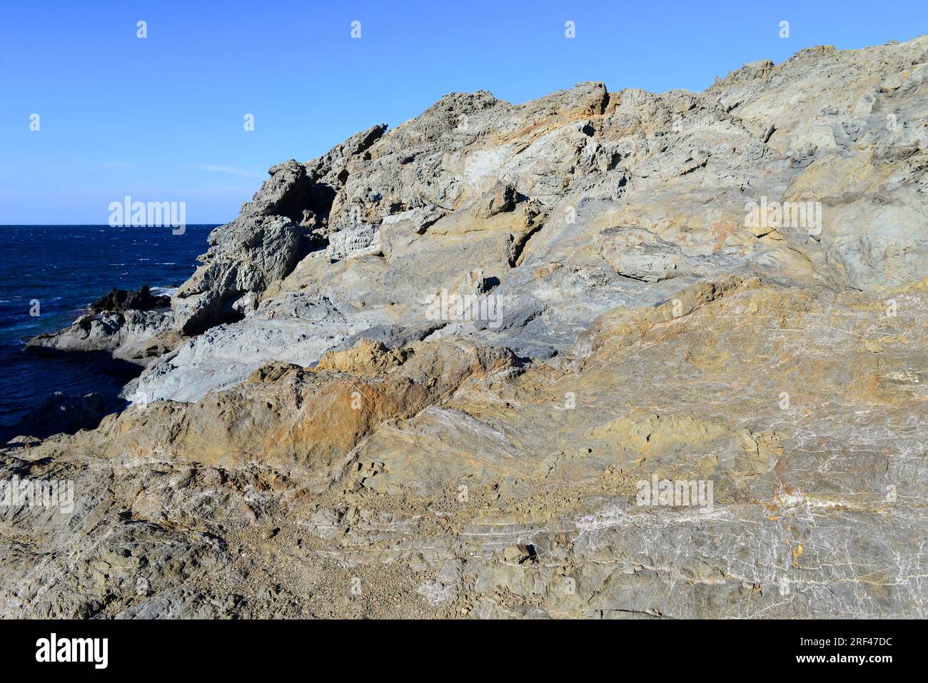 Schist relief. Schist is a metamorphic rock composed mainly by quartz ...