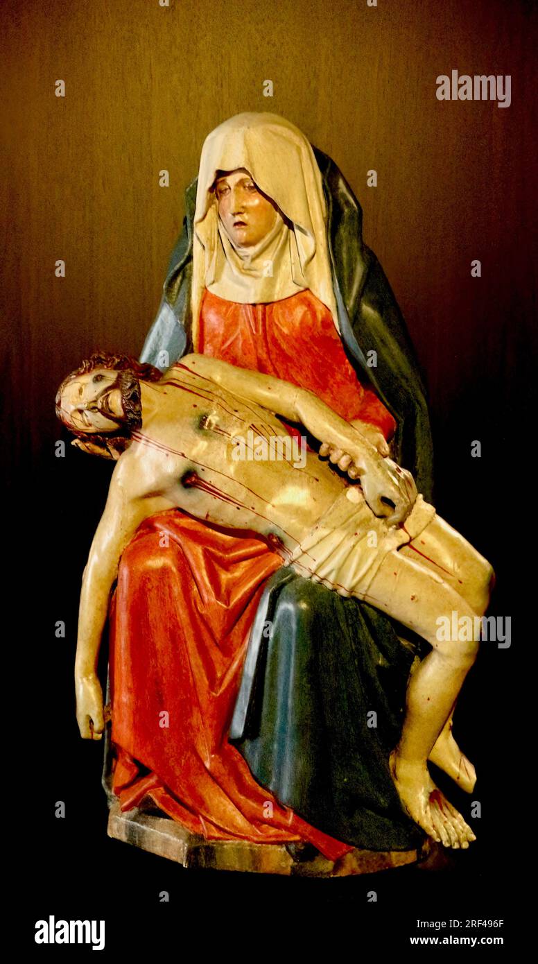 Painted wooden sculpture of Mary cradling Jesus after death on display in the cathedral museum Santiago de Compostela Galicia Spain Stock Photo