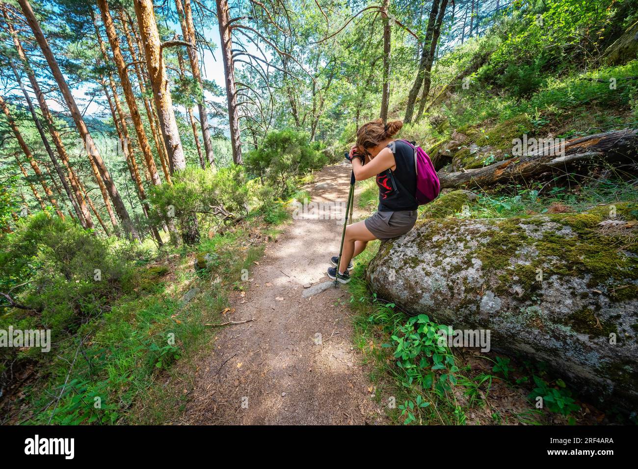 Female hiker sitting on rock hi-res stock photography and images - Alamy