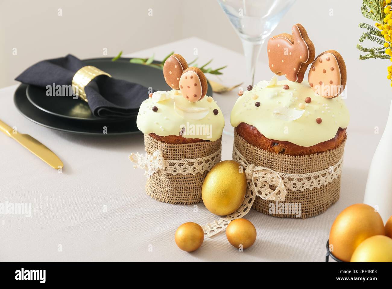 Easter cakes with eggs on light tablecloth, closeup Stock Photo