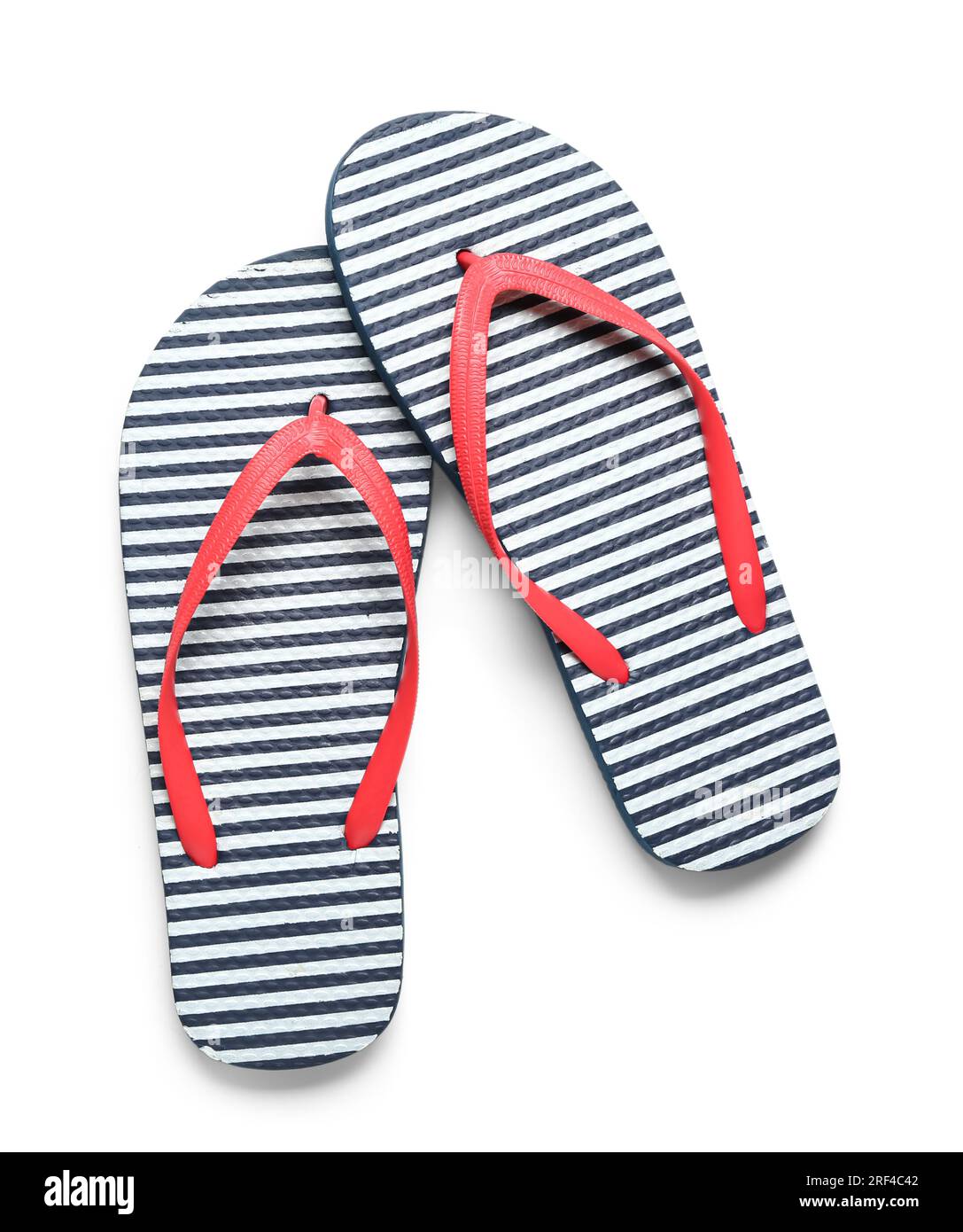 Pair of striped flip-flops on white background Stock Photo - Alamy