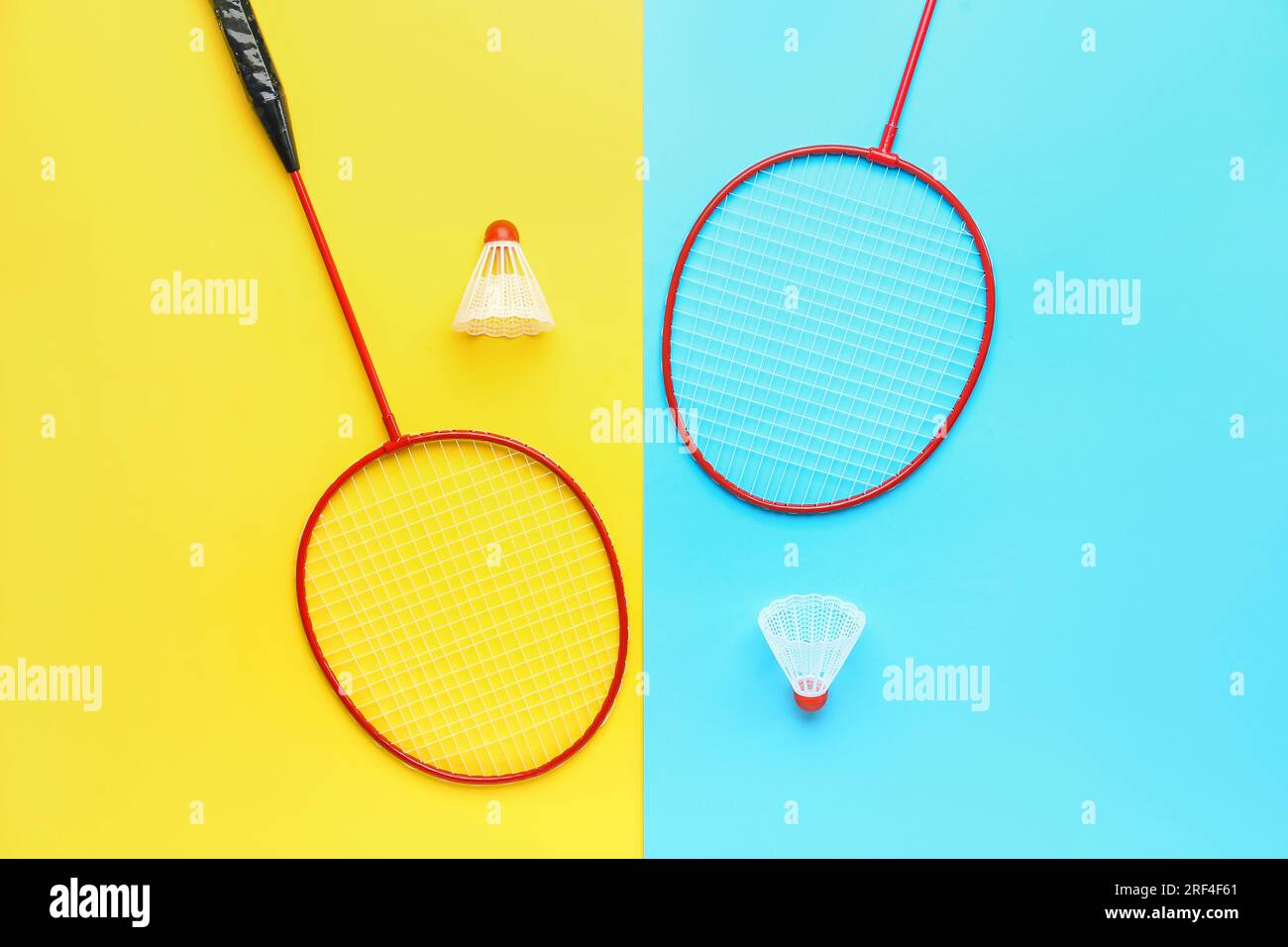 Badminton shuttlecocks and rackets on color background Stock Photo