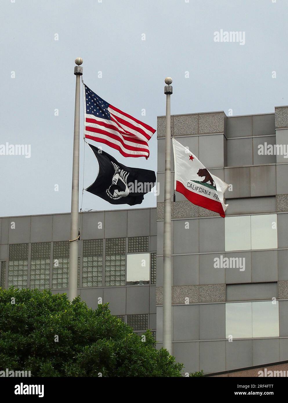 American, California and POW MIA flags flying in  Los Angeles, California, Stock Photo
