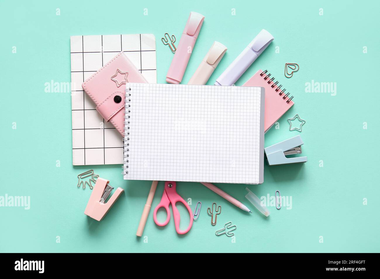 Composition with blank notebook and different school stationery on ...