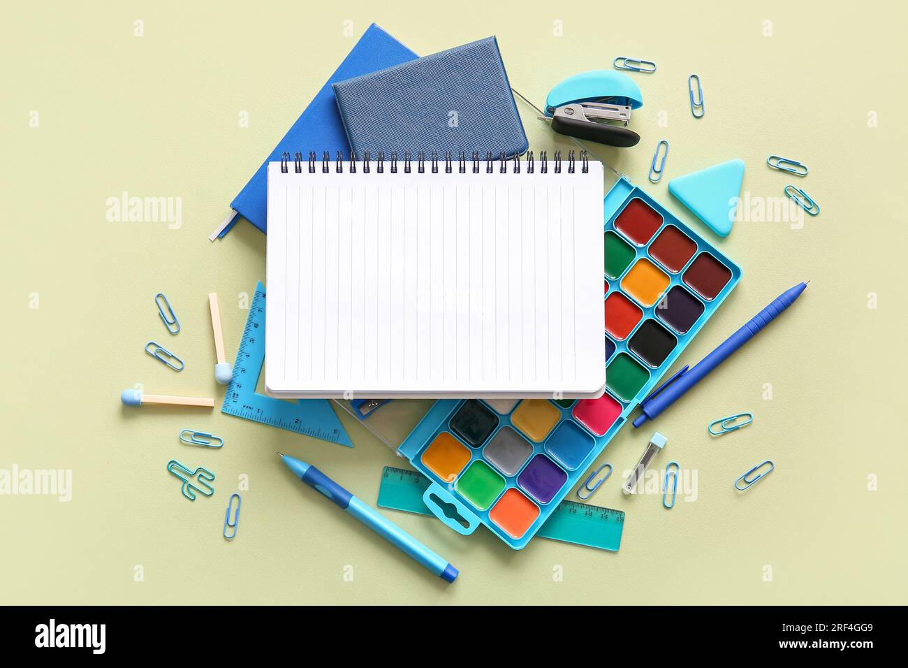 Composition with blank notebook and different school stationery on ...