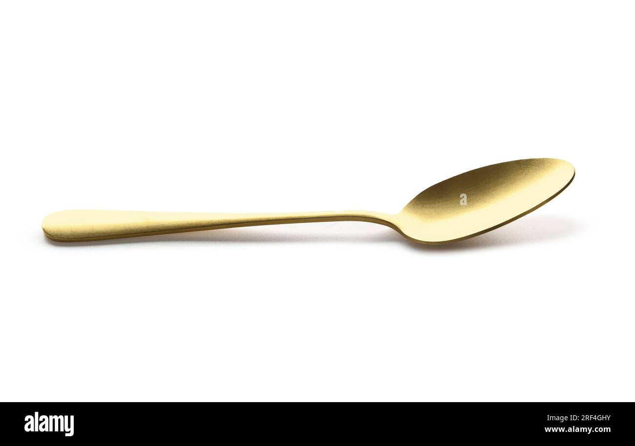 Golden spoon on white background Stock Photo - Alamy