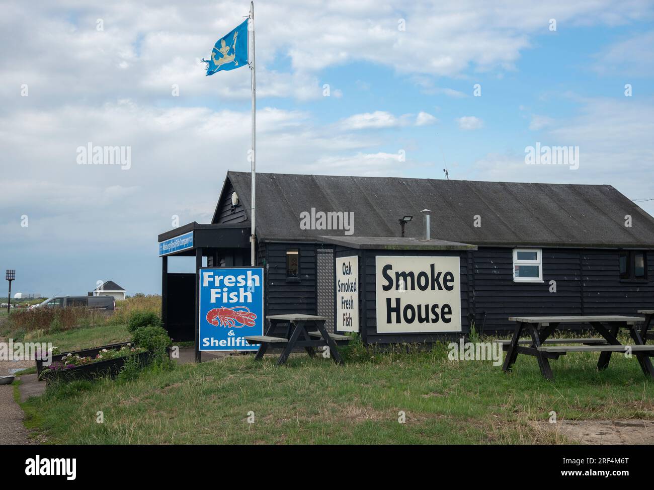 Traditional fish smokehouse on the beach in the tourist seaside town of Aldeburgh on the Suffolk coast, England, UK Stock Photo