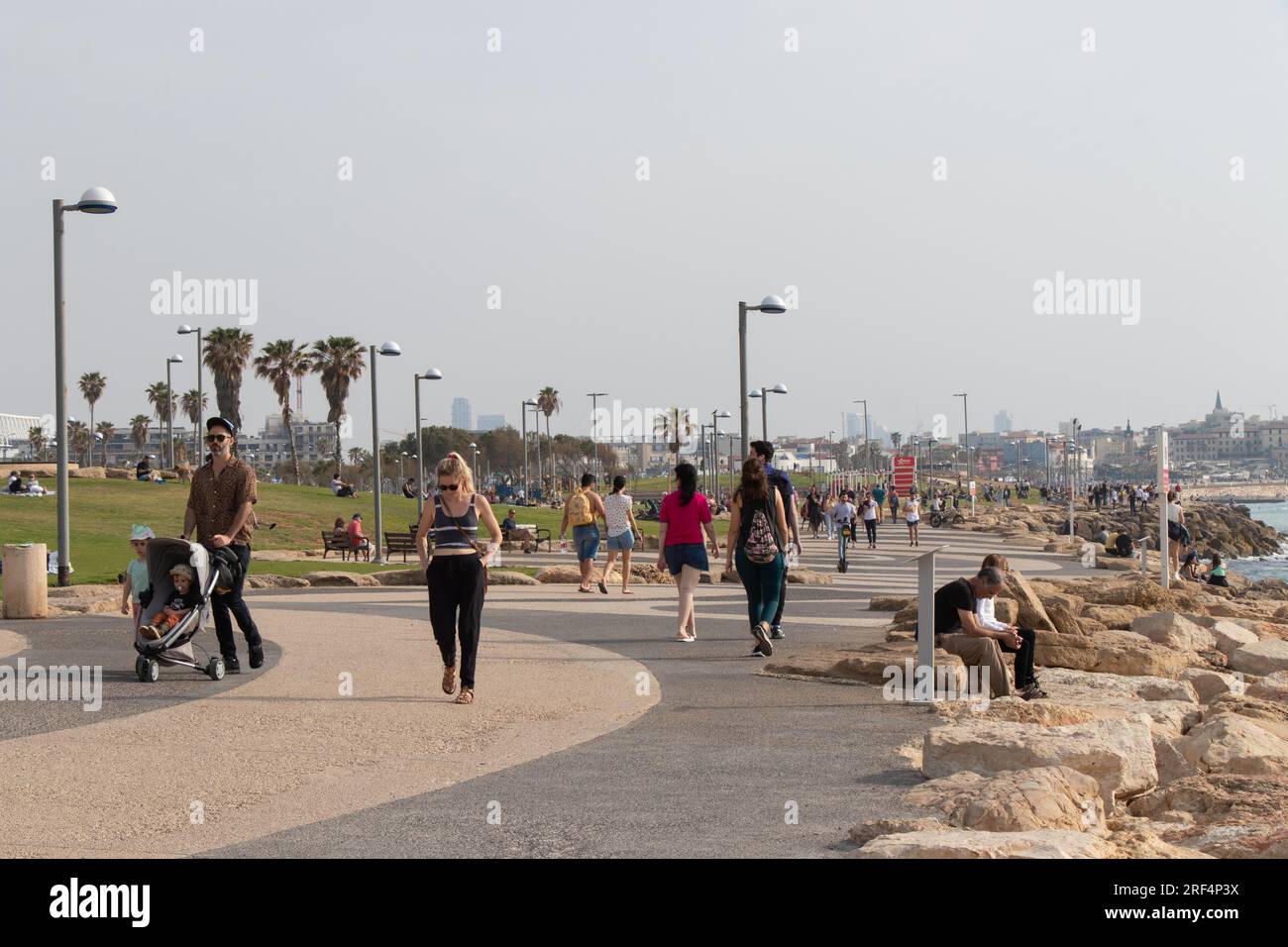 Tel Aviv - Jaffa, Israel: 23 April 2022. People are walking on the beach of Jaffa. Stock Photo
