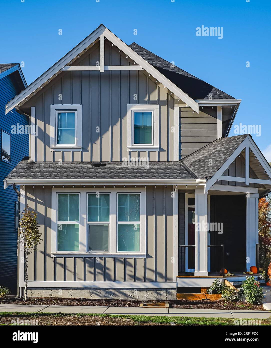 Modest average residential house in North America. Entrance of brand