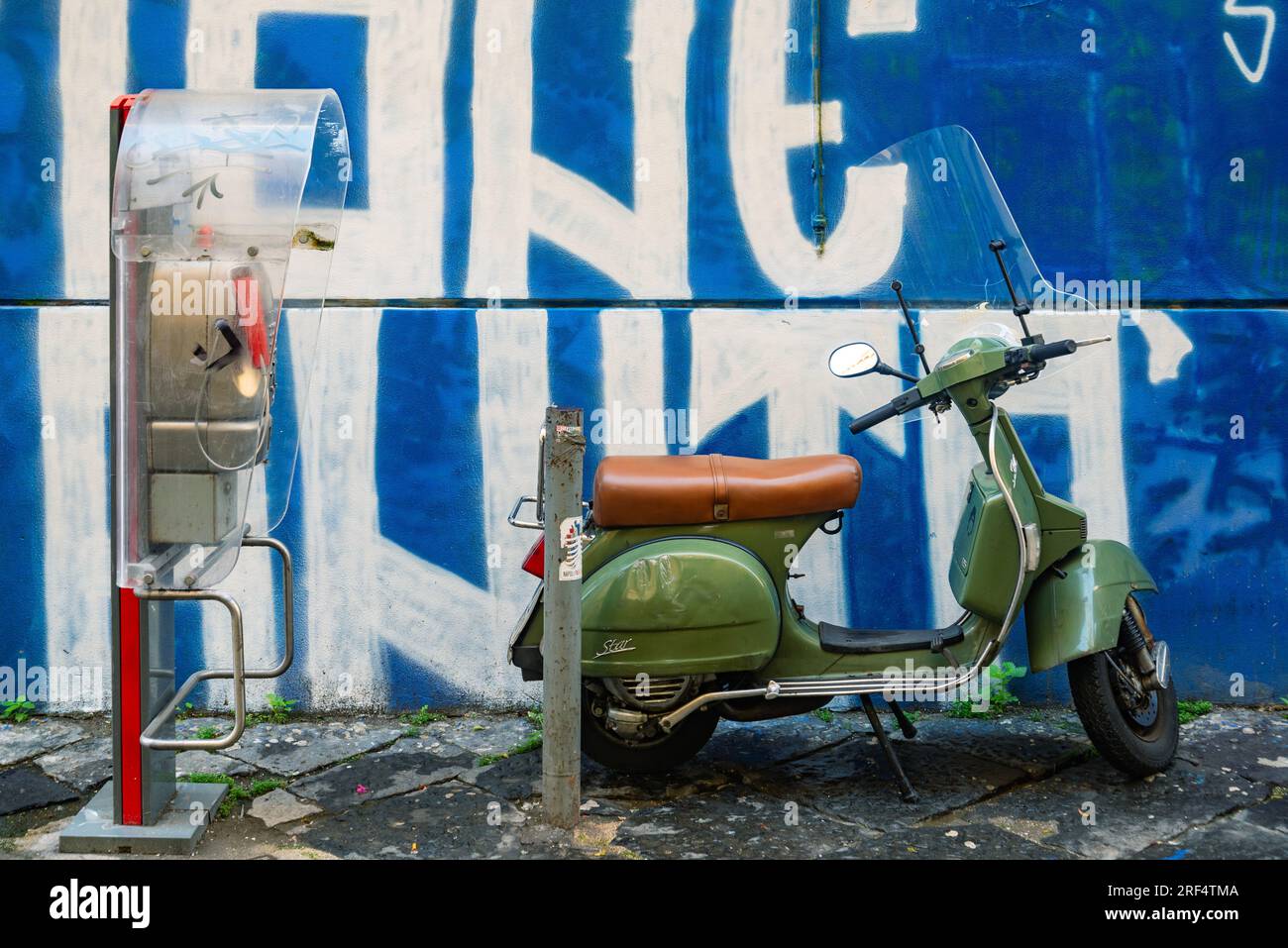 Naples, Italy. December 17, 2022 Old white Vespa scooter parked on