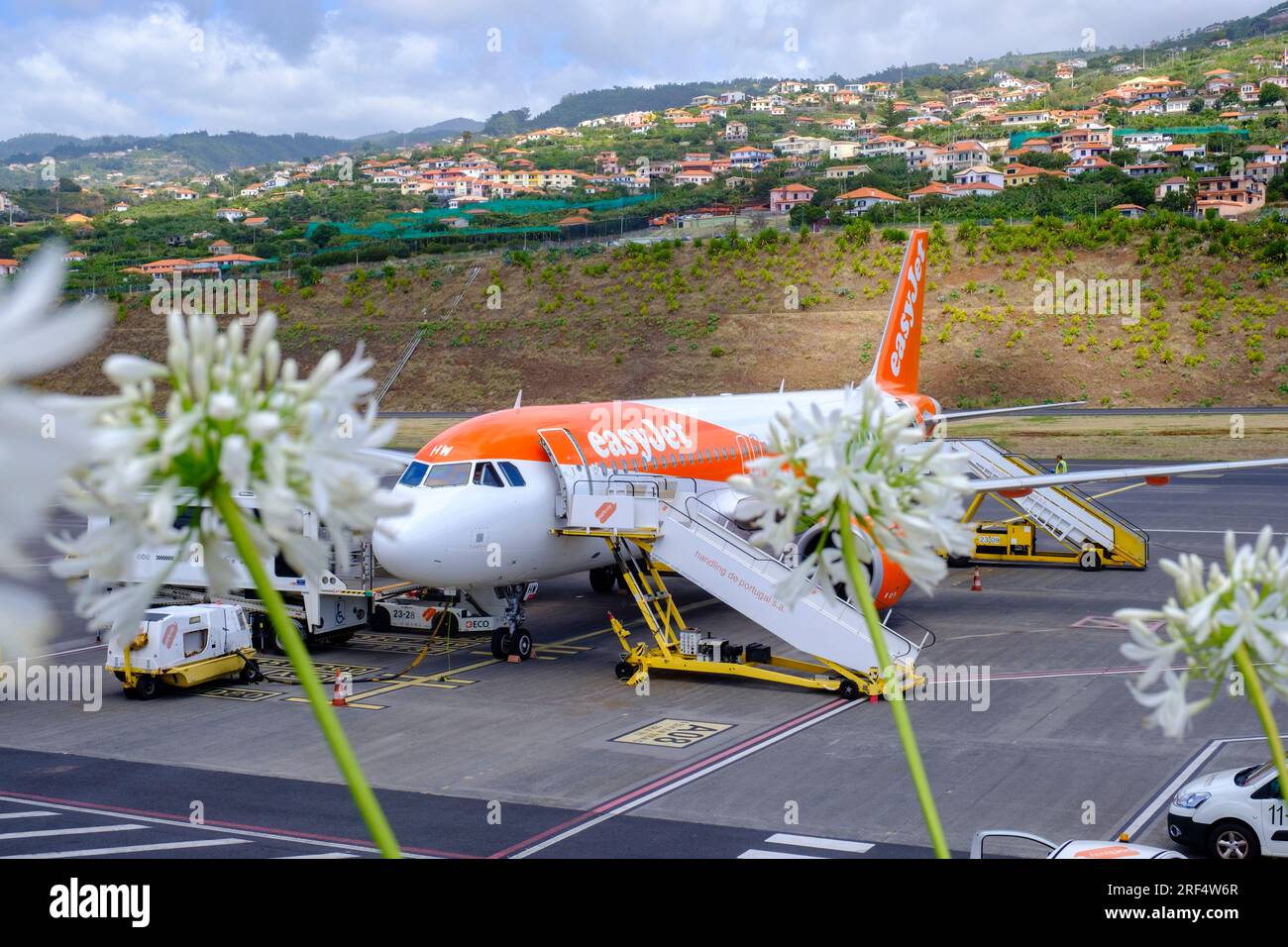 Air travel, Easyjet Airbus A320-251N ready for boarding at the tarmac, Madeira Island Airport, Portugal Stock Photo