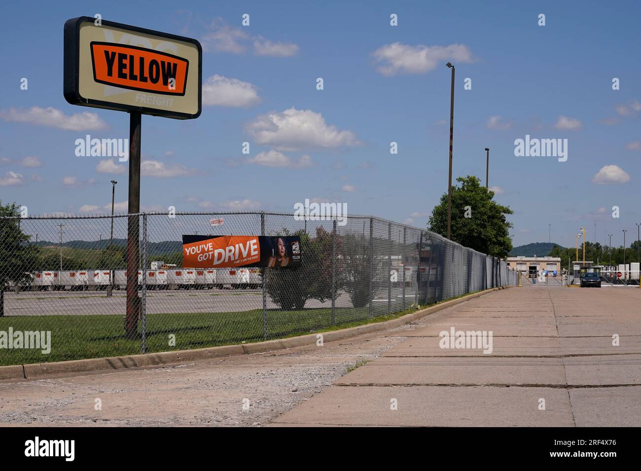 A sign for Yellow Corp. trucking company stands outside its facility