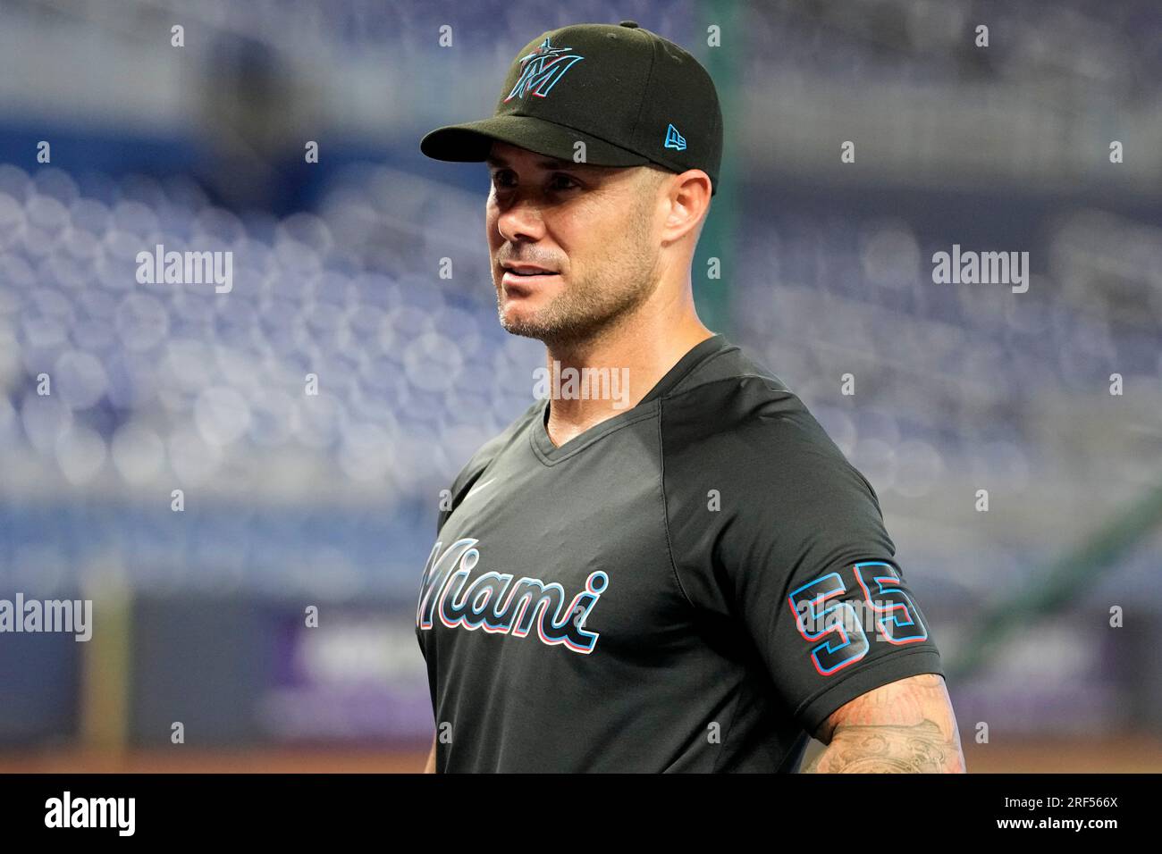 Miami Marlins manager Skip Schumaker stands on the field before a