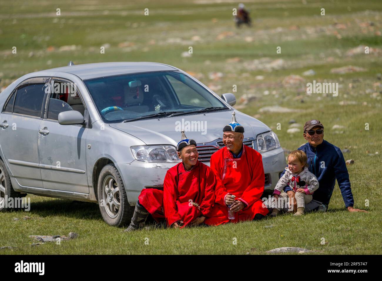 People in traditional dress waiting for the start of a local Naadam ...