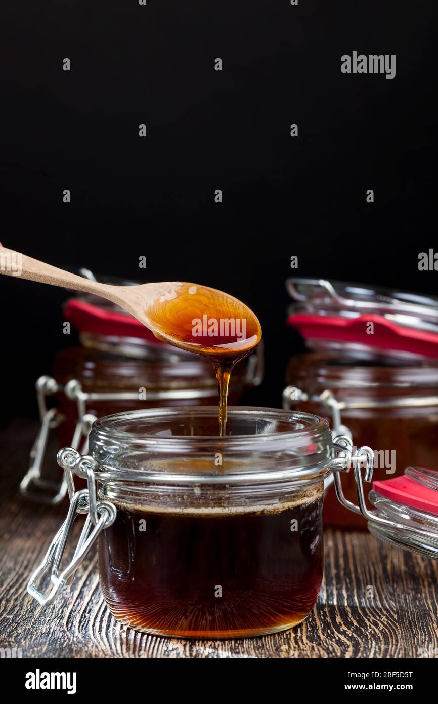 thick and sweet buckwheat honey of dark red color from buckwheat