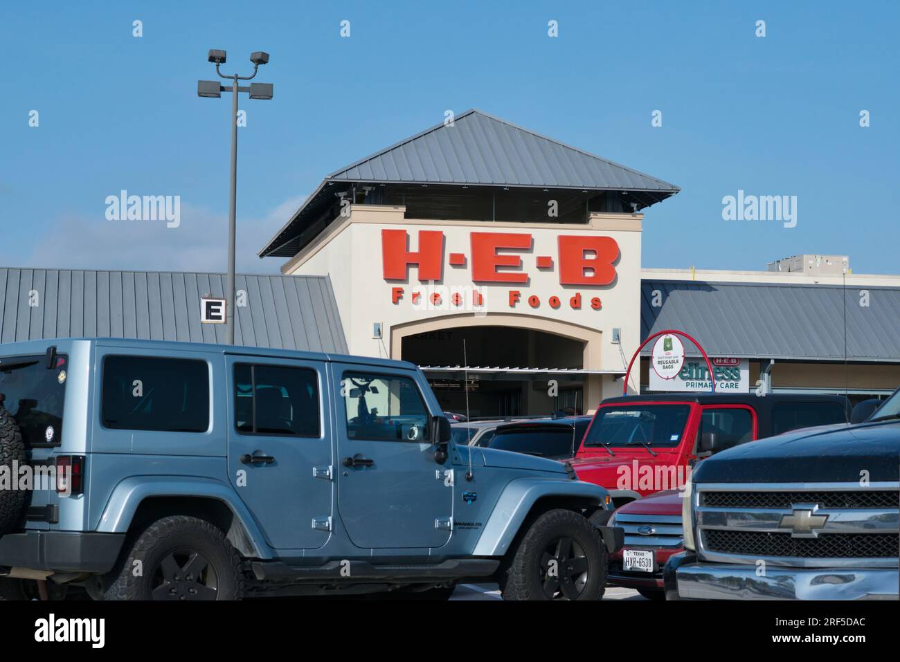 Houston, Texas USA 07302023 HEB grocery storefront and parking lot